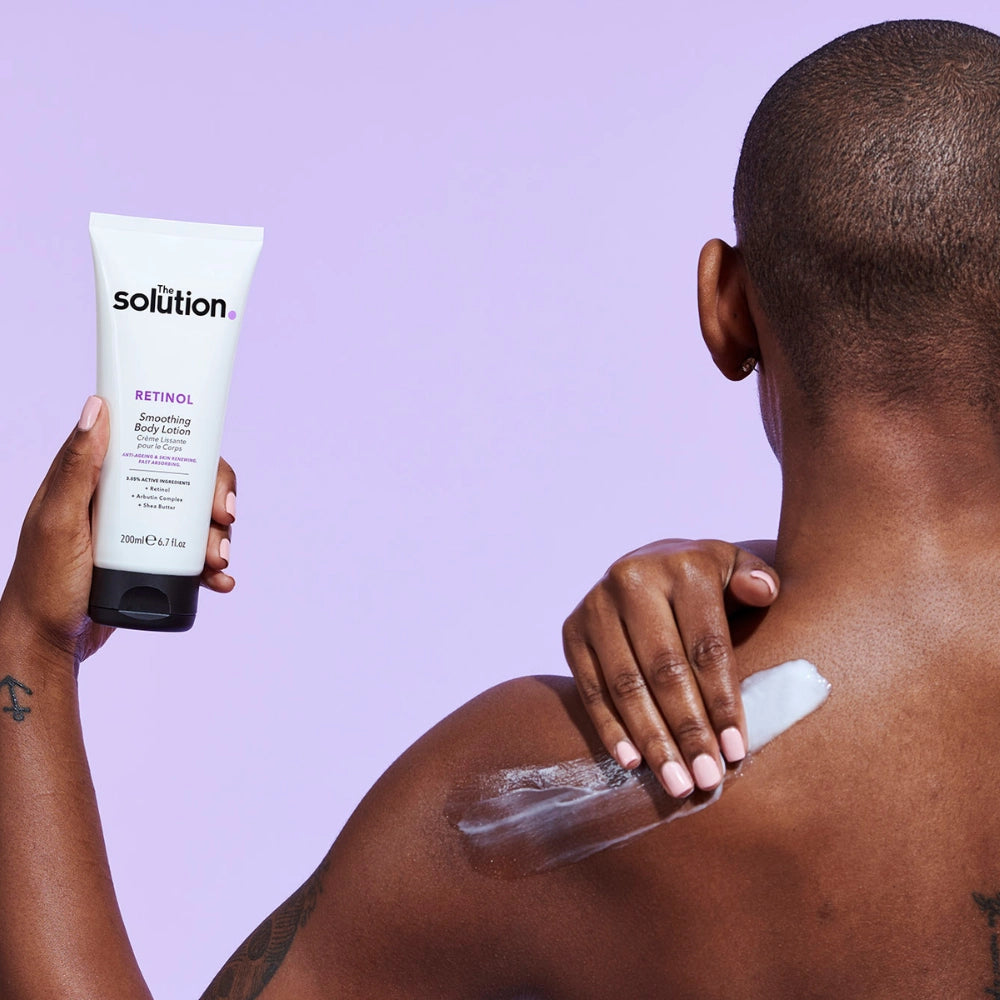 Model applying The Solution Retinol Smoothing Body Lotion